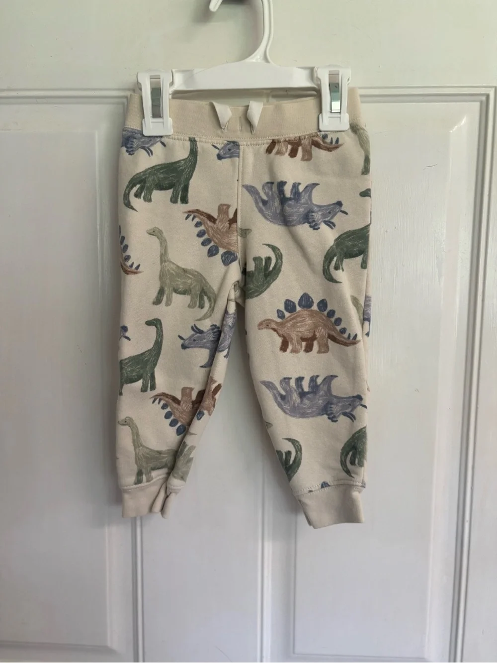 18M Carter's cream/Multicolored Dinosaur sweatshirt and sweatpants set.  In VGUC